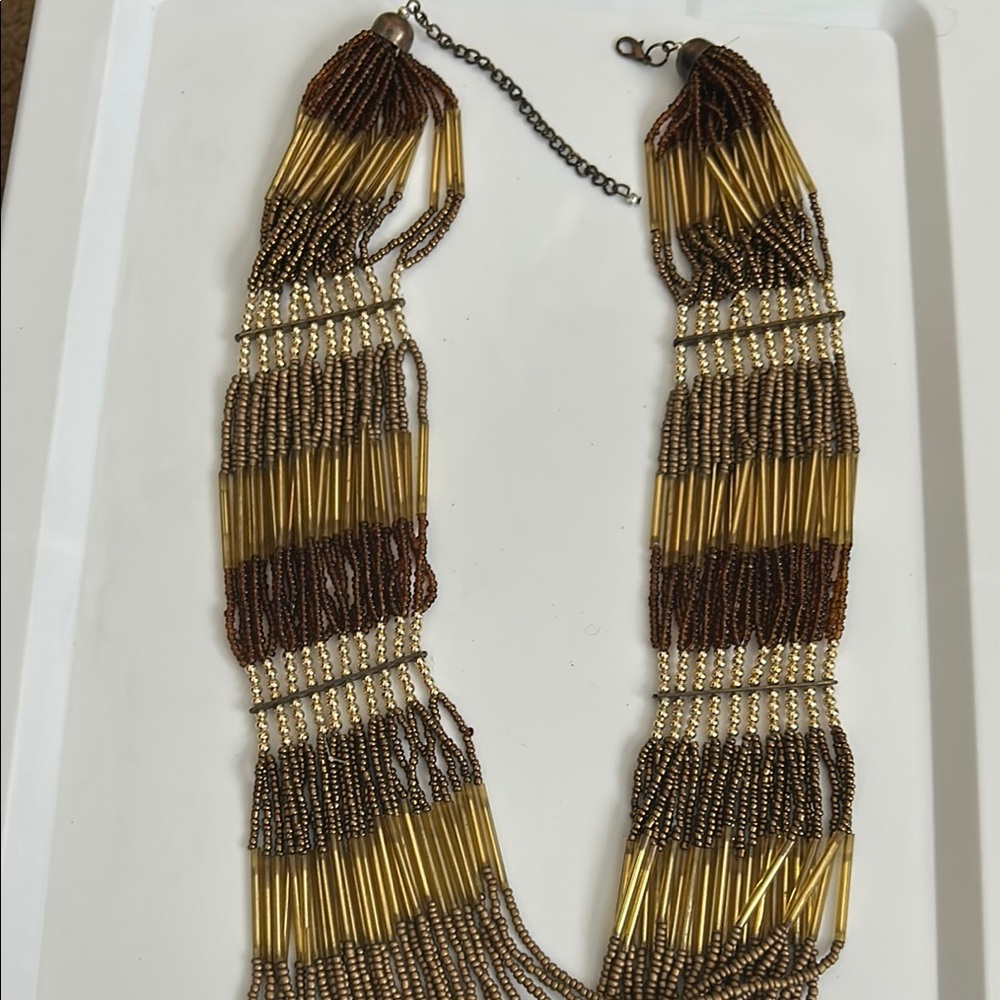 Elegant Gold and Brown Necklace with Fringe Design